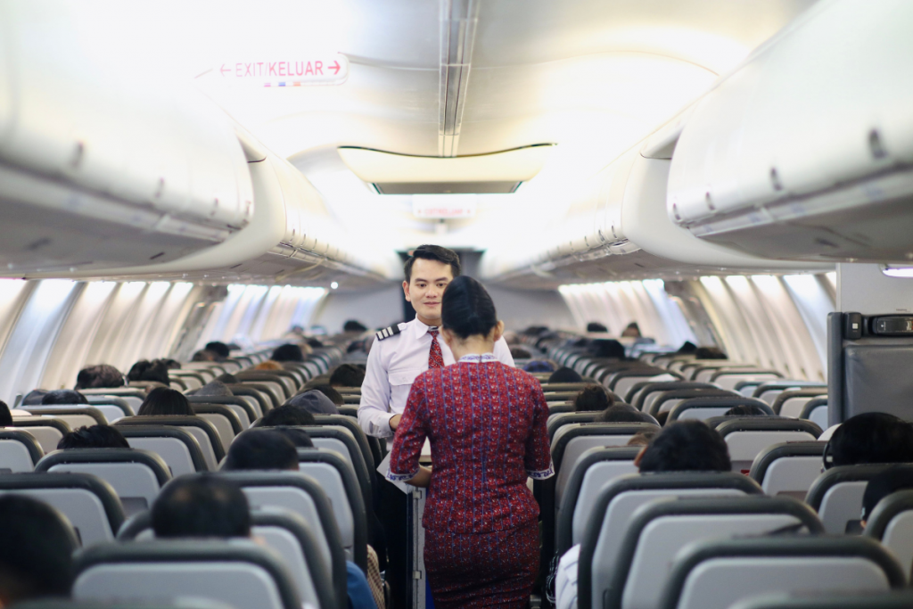 Cabin crew member using a tablet during flight operations