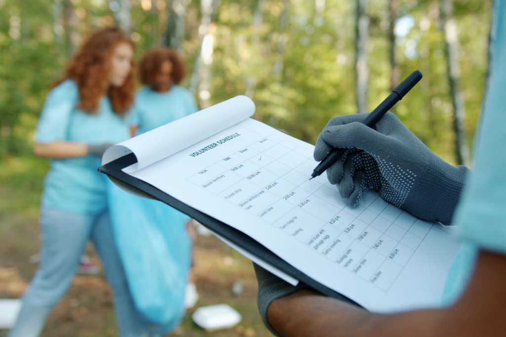 Cleaning service staff member completing a task checklist during a shift