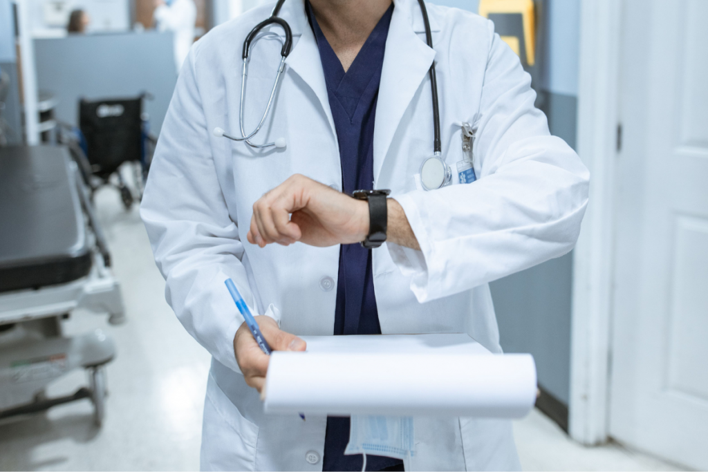Nurses reviewing patient information during a night shift handover in a hospital