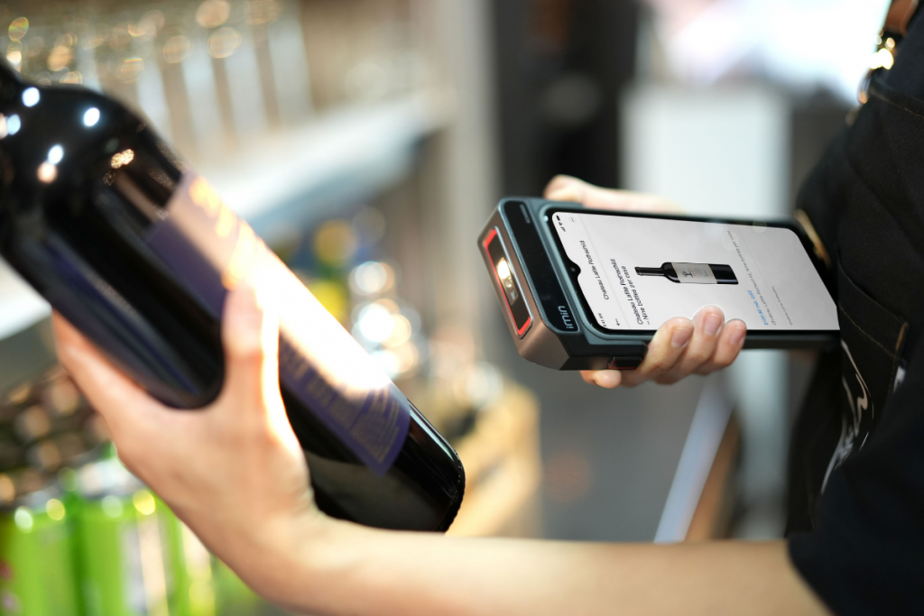 Retail employee using a handheld scanner for inventory counting