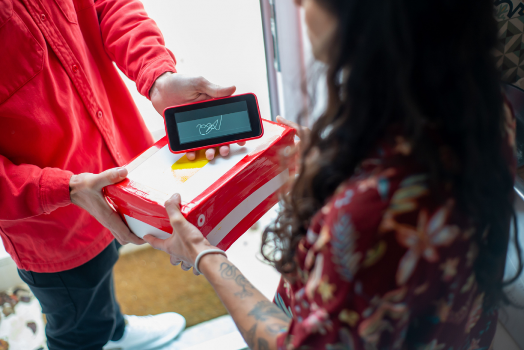 Courier confirming a delivery using a mobile signature app